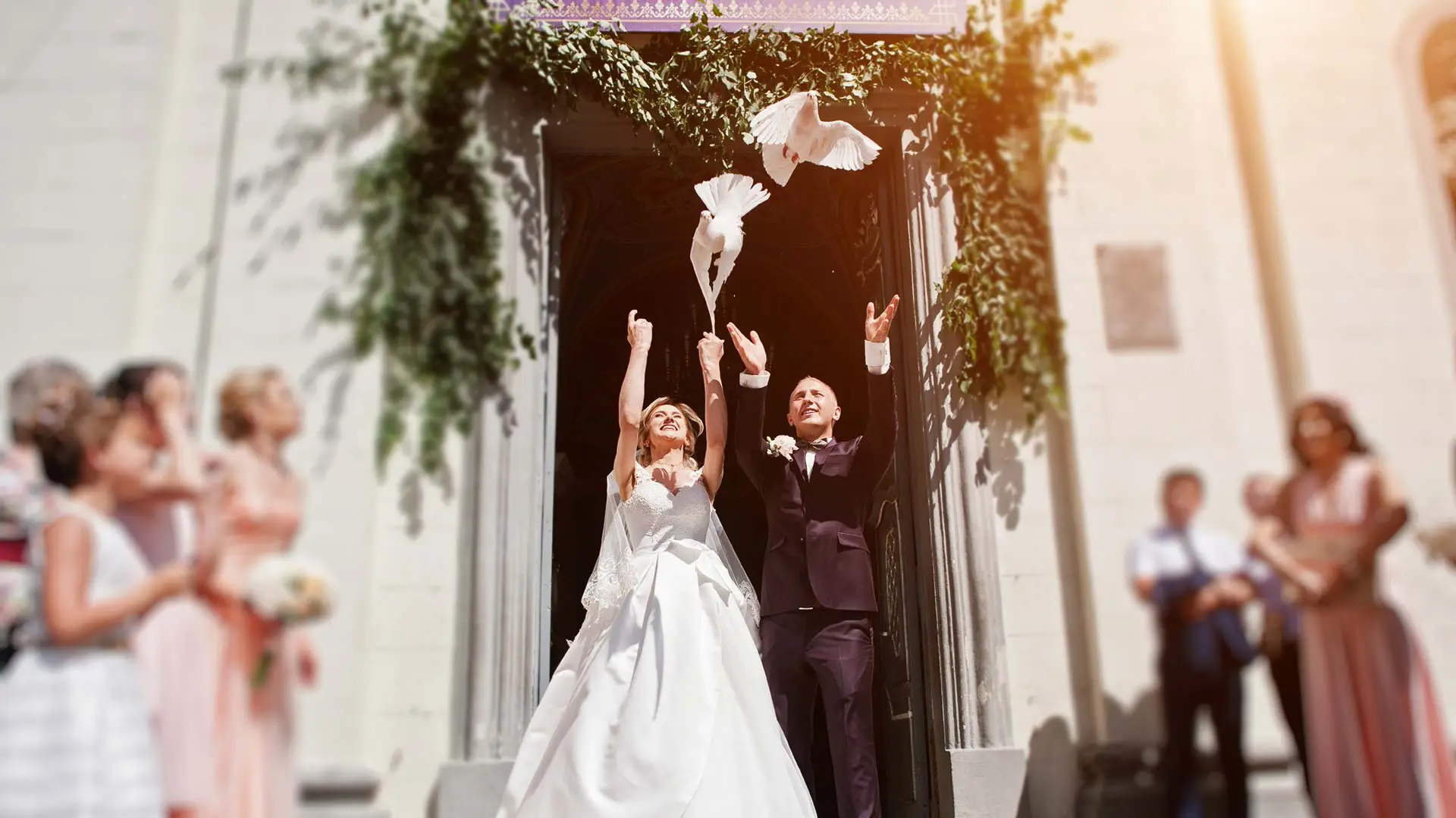 Two beautiful white doves being released by the bride and groom at a wedding ceremony in Baltimore, MD.